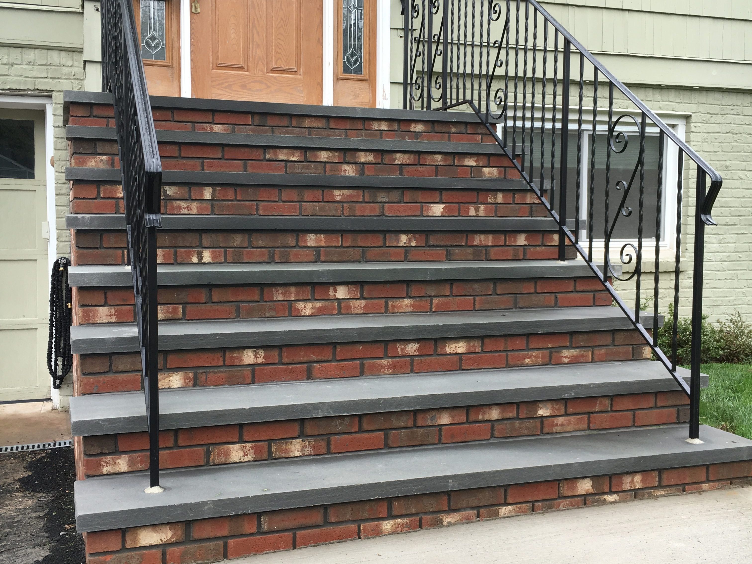 Using brick and bluestone is a great combination for strong, sturdy steps.