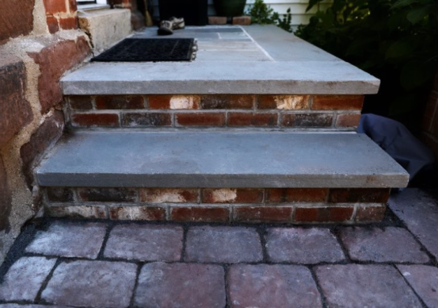 A step of steps and stoop that was quickly repaired